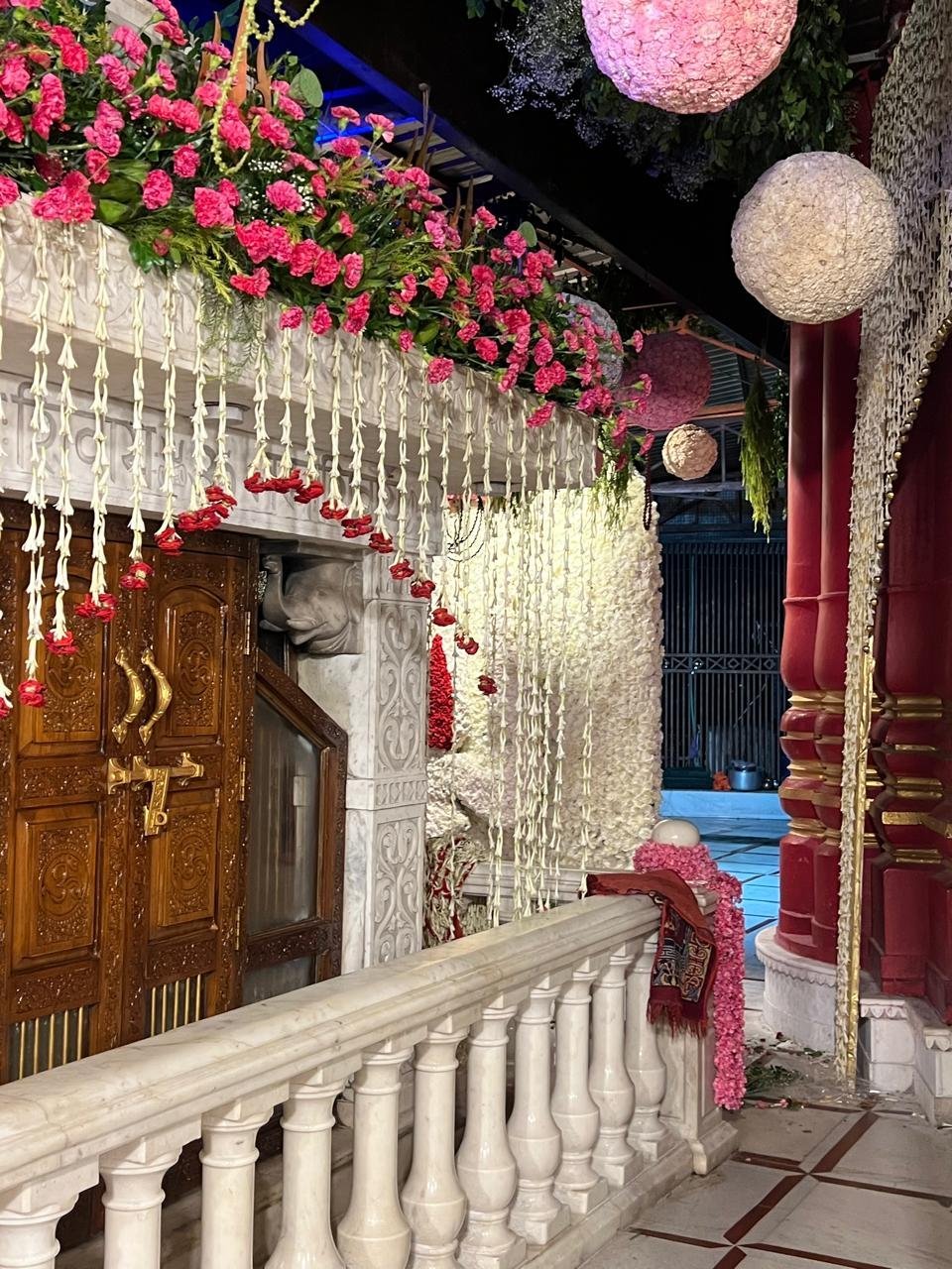 Marble temple dressed in pink and white flowers