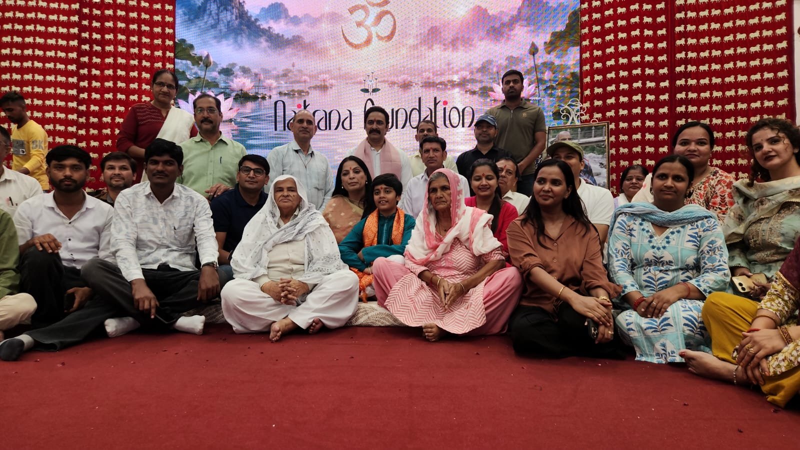 Guests and family seated at the Jaunapur program