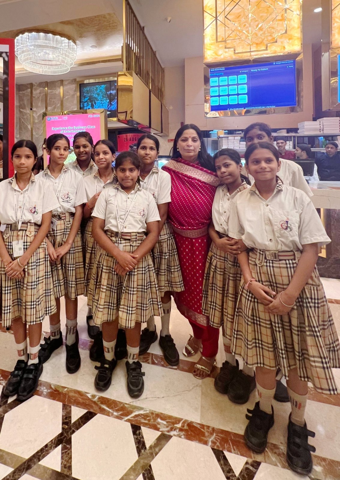 Isha Saini with schoolgirls in the PVR lobby