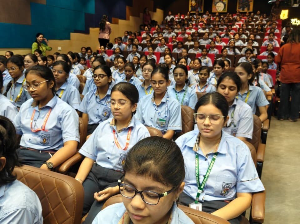 Students meditating with eyes closed during the session at Modern Public School, Shalimar Bagh