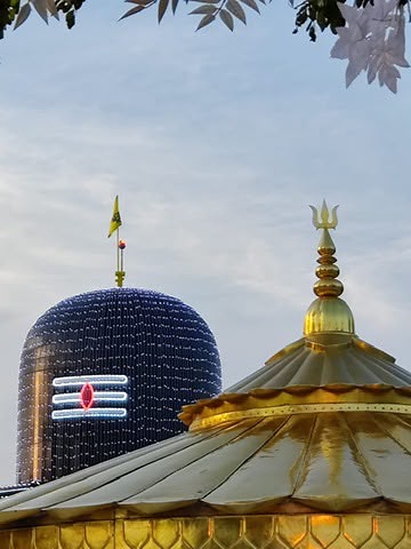 Shivling dome and golden trident roof at Bada Mandir